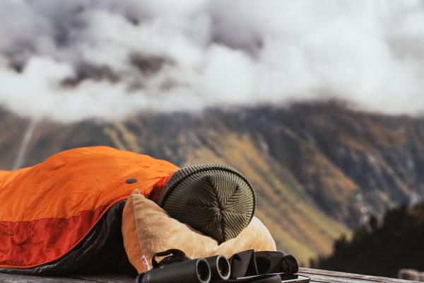 camping tent on cliff during golden hour