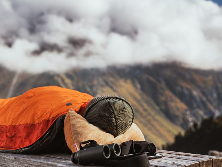 camping tent on cliff during golden hour