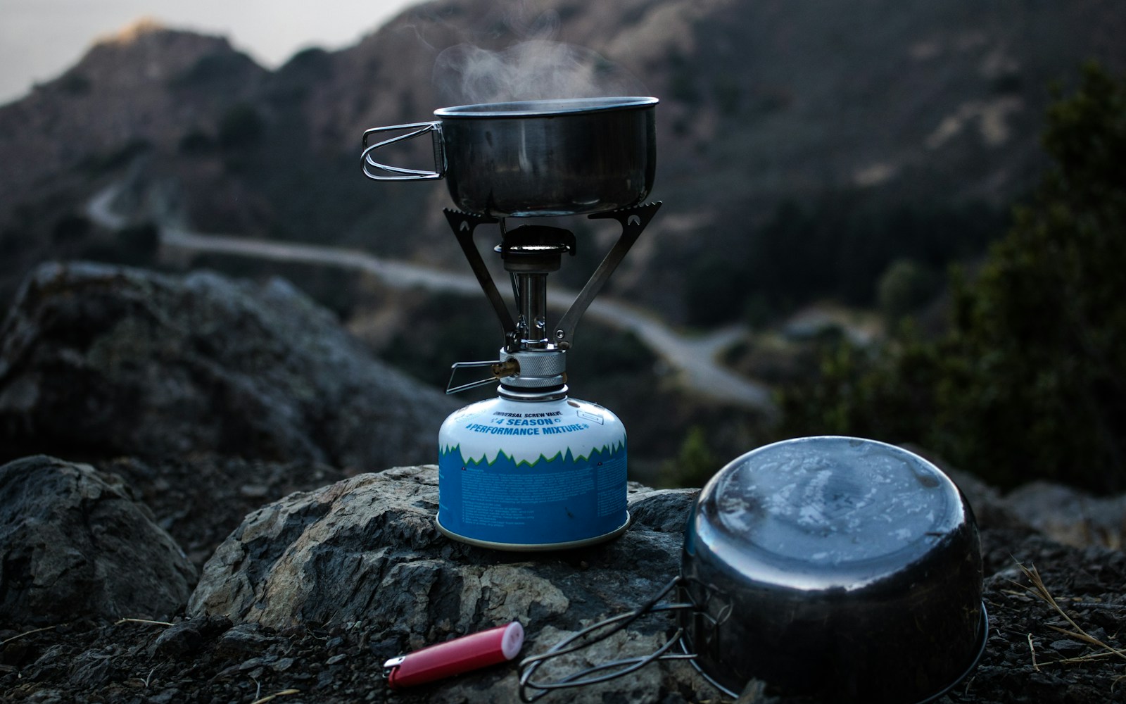 Lightweight backpacking stove and cooking pan outdoors