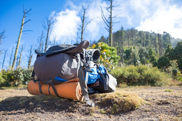 camping tent on cliff during golden hour