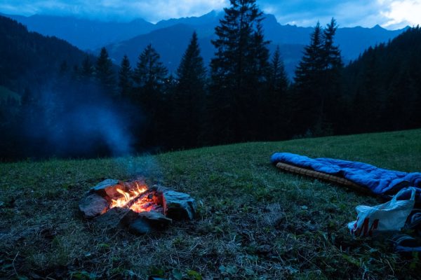camping tent on cliff during golden hour