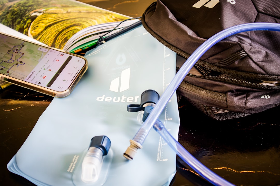 Hiking gear: water bladder, backpack, and phone map