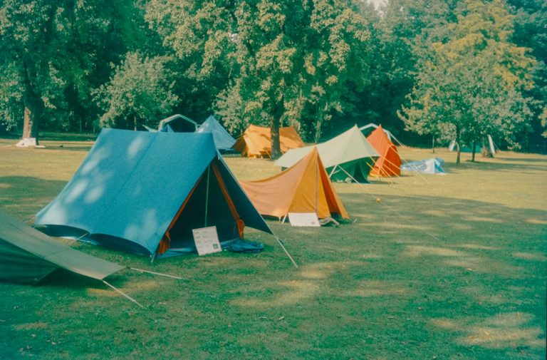 A campsite with many colorful tents is seen